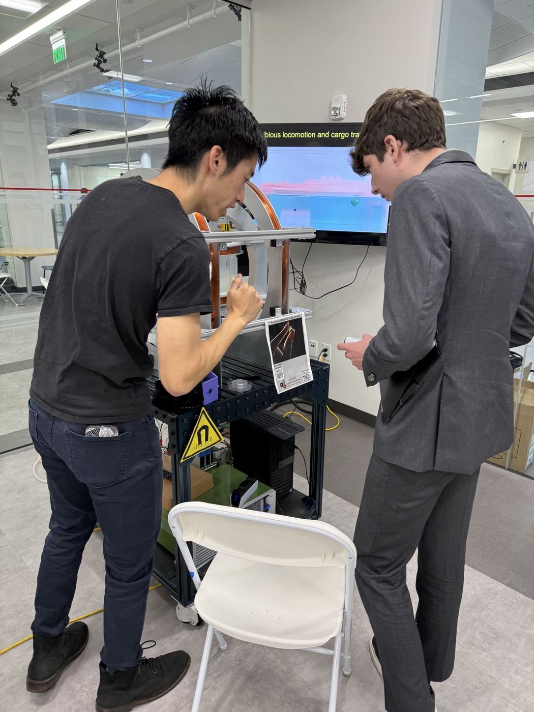 Reviewing a prototype on a monitor during an EBIT visit.