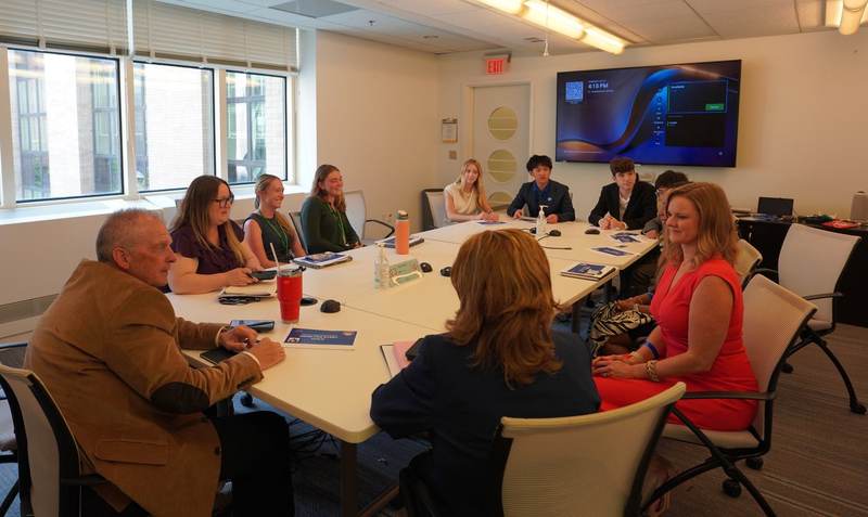 A meeting around a conference table.